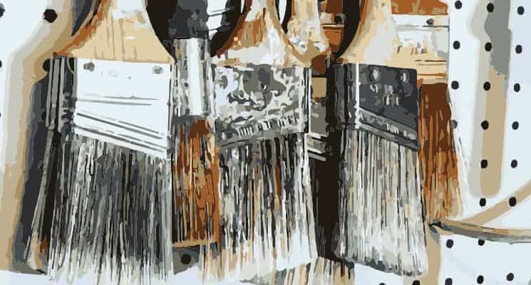 hanging home paint brushes on wall