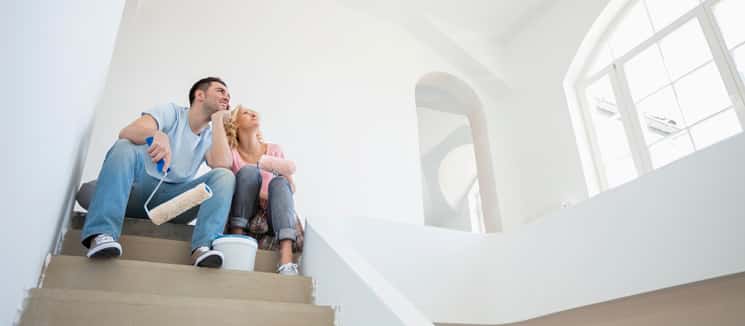 couple sitting looking at newly painted rood